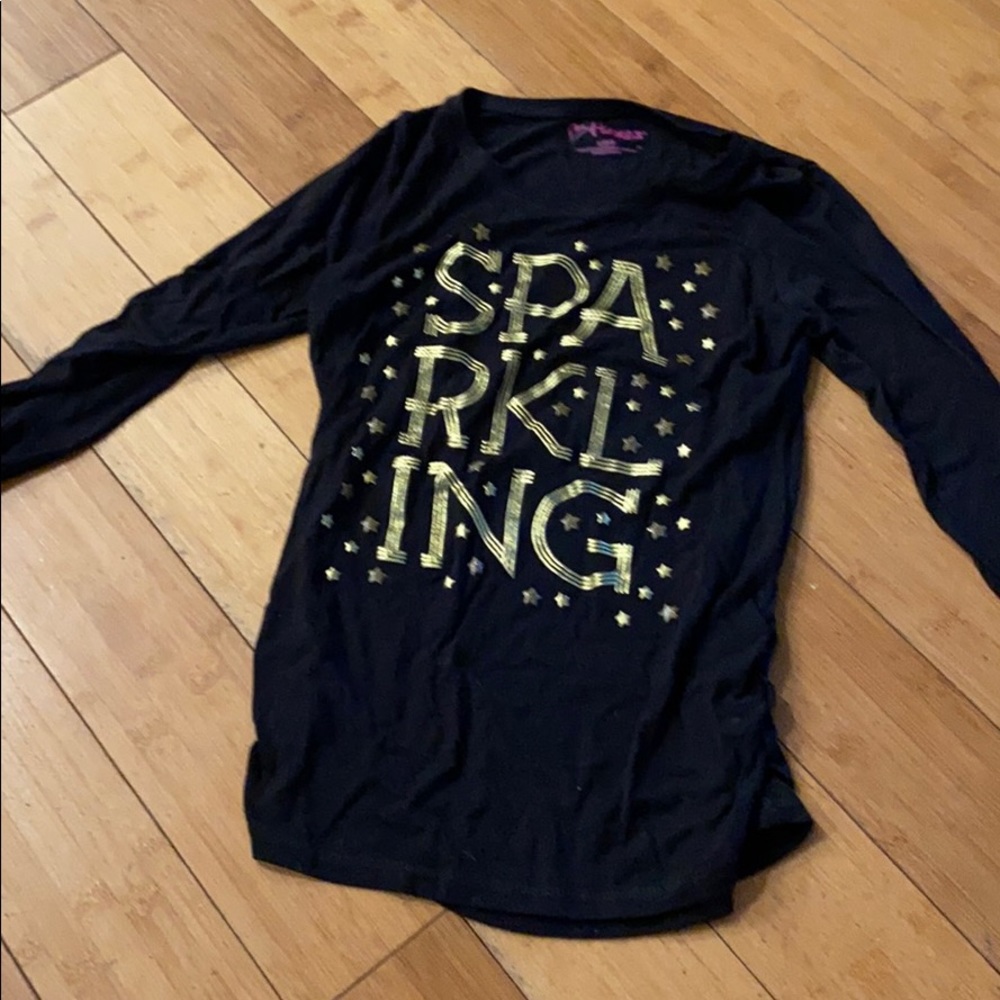 Black long sleeve top with gold lettering
